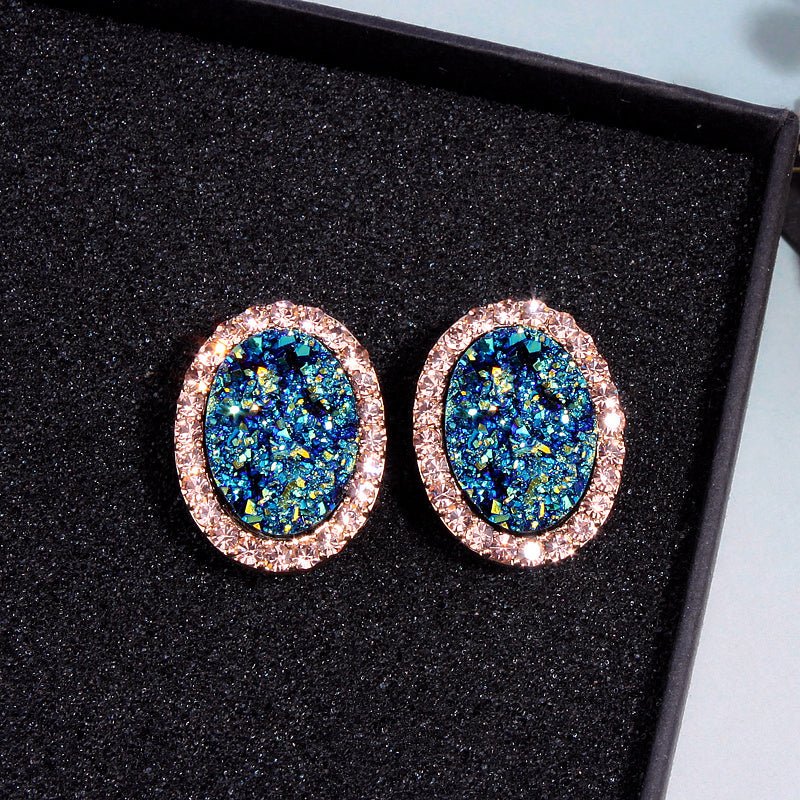 Blue oval diamond color-changing earrings-Jewearrings