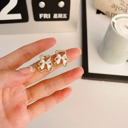 Delicate Pearl Bow Earrings - Sterling Silver Studs or Clips-Jewearrings