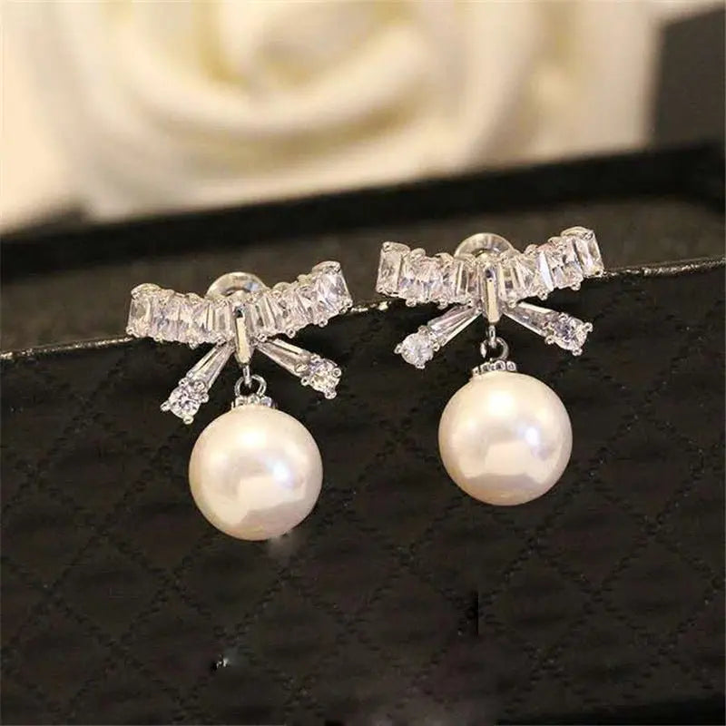 Elegant Pearl Bow Earrings - Sterling Silver-Jewearrings