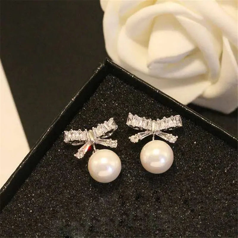 Elegant Pearl Bow Earrings - Sterling Silver-Jewearrings