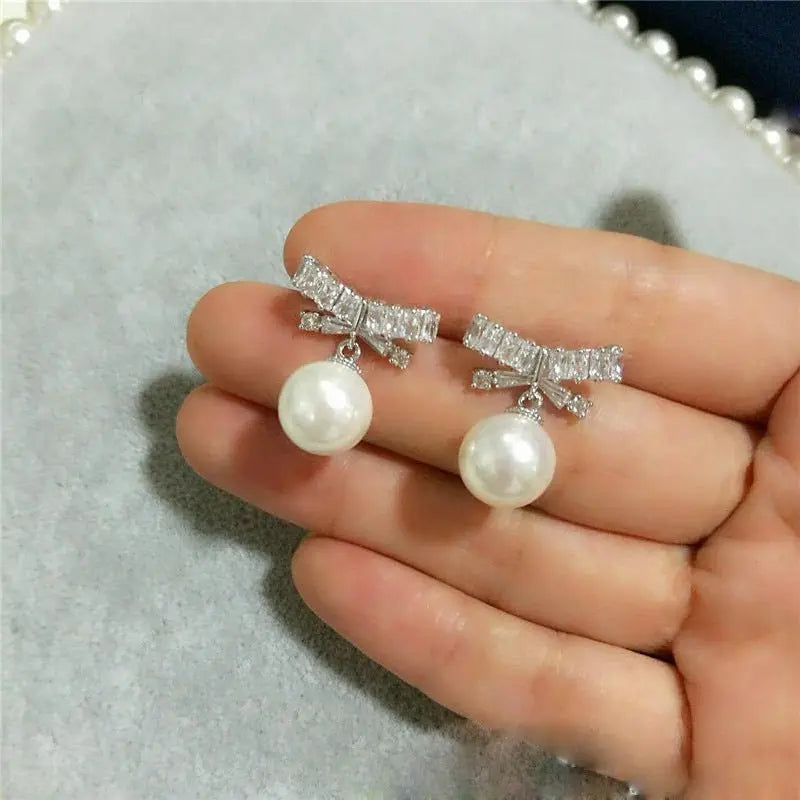 Elegant Pearl Bow Earrings - Sterling Silver-Jewearrings