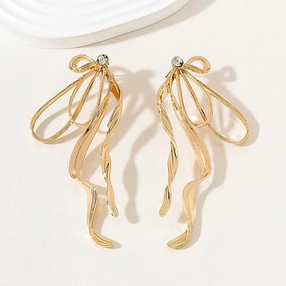 Stand Out From The Crowd: Gold Bow Earrings For Women-Jewearrings