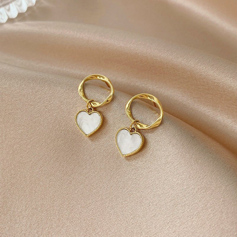 Twisted geometric white shell earrings-Jewearrings